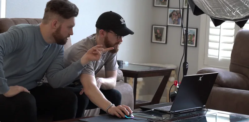 Jordan and Andrew working at a laptop